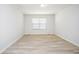 Minimalist bedroom with bright window and neutral paint scheme at 3677 Cedar Cove Ct, New Palestine, IN 46163