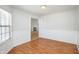 Bright dining room with chair rail, wood floors and view of the fireplace in the next room at 3677 Cedar Cove Ct, New Palestine, IN 46163