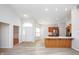 Open-concept area features a bright entryway leading to a modern kitchen with stainless steel appliances at 3677 Cedar Cove Ct, New Palestine, IN 46163