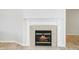 Elegant fireplace featuring a decorative mantle and tiled surround at 3677 Cedar Cove Ct, New Palestine, IN 46163
