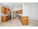 Bright kitchen features stainless steel appliances, wood cabinets, and durable countertops at 3677 Cedar Cove Ct, New Palestine, IN 46163