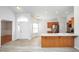 Bright, open space with new flooring featuring the kitchen with a breakfast bar and modern appliances at 3677 Cedar Cove Ct, New Palestine, IN 46163