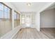 Sunroom with a door to the backyard, view of the yard, and bright windows at 3677 Cedar Cove Ct, New Palestine, IN 46163