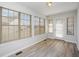 Sunroom with many windows and natural light, with a door leading outside at 3677 Cedar Cove Ct, New Palestine, IN 46163