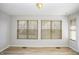 Bright sunroom with multiple windows bringing in lots of natural light at 3677 Cedar Cove Ct, New Palestine, IN 46163