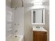 Bathroom featuring a vanity, mirror, shower, and updated lighting at 3732 Wellington Ave, Indianapolis, IN 46226