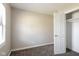 Carpeted bedroom featuring a closet, base trim, and neutral walls at 3732 Wellington Ave, Indianapolis, IN 46226