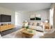 Bright living room with stylish decor, plush seating, and large windows filling the space with natural light at 3732 Wellington Ave, Indianapolis, IN 46226