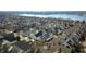 An aerial view of a neighborhood with homes with various roof styles near a lake at 4215 Heyward Pl, Indianapolis, IN 46250
