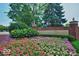 Beautiful community entrance with lush flowerbeds and well-manicured landscaping at 4215 Heyward Pl, Indianapolis, IN 46250