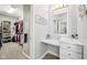 This dressing area has a marble counter and access to the walk-in closet at 4215 Heyward Pl, Indianapolis, IN 46250