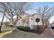 Charming home with an inviting front porch, manicured lawn, and a brick sidewalk enhancing curb appeal at 4215 Heyward Pl, Indianapolis, IN 46250