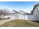 Home featuring a well-maintained lawn, fenced-in area, and a convenient two-car garage at 4215 Heyward Pl, Indianapolis, IN 46250