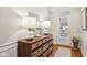 Well-lit foyer with hardwood floors, stylish console table, and elegant decor at 4215 Heyward Pl, Indianapolis, IN 46250