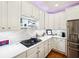 Modern kitchen with stainless steel appliances and white cabinets at 4215 Heyward Pl, Indianapolis, IN 46250