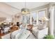 Bright living area with large windows, stylish seating, and a cozy fireplace at 4215 Heyward Pl, Indianapolis, IN 46250
