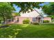 A spacious backyard and well-manicured lawn complement this single-story brick home, creating a tranquil outdoor retreat at 5115 Baltustrol Dr, Avon, IN 46123