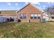 Home exterior with backyard and brick detail at 5115 Baltustrol Dr, Avon, IN 46123