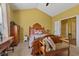 Vaulted ceilings and a large window create a bright, spacious ambiance in this comfortable bedroom at 5115 Baltustrol Dr, Avon, IN 46123