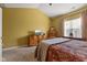 Bedroom features natural lighting, vaulted ceilings, carpet floors, and light yellow walls at 5115 Baltustrol Dr, Avon, IN 46123