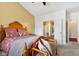 Comfortable bedroom with access to a hallway and sitting bench near the window at 5115 Baltustrol Dr, Avon, IN 46123