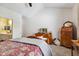 Bedroom with vaulted ceilings, carpet, dresser, and ensuite bathroom entrance at 5115 Baltustrol Dr, Avon, IN 46123