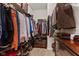 Walk-in closet featuring organized shelving and hanging rods with a carpet floor at 5115 Baltustrol Dr, Avon, IN 46123