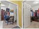 Spacious closet with organized shelving, hanging rods, carpet floors, and a cozy seating area at 5115 Baltustrol Dr, Avon, IN 46123