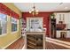 Cozy dining area with wood floors, bright windows, and an elegant chandelier at 5115 Baltustrol Dr, Avon, IN 46123