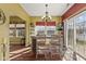 Bright dining room area featuring a light fixture and access to the exterior through a sliding glass door at 5115 Baltustrol Dr, Avon, IN 46123