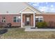 Inviting entryway features a brick facade, decorative front door, and a well-maintained garden adding charm at 5115 Baltustrol Dr, Avon, IN 46123