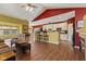 Open kitchen featuring white cabinets, stainless appliances, and a breakfast bar with counter seating at 5115 Baltustrol Dr, Avon, IN 46123