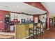 Well-appointed kitchen with granite countertops, breakfast bar, stainless steel appliances, and white cabinets at 5115 Baltustrol Dr, Avon, IN 46123