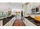 Modern kitchen featuring stainless steel appliances and a seamless transition to dining area at 5115 Baltustrol Dr, Avon, IN 46123