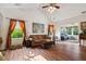 Comfortable living room boasts high ceilings and expansive windows with backyard views at 5115 Baltustrol Dr, Avon, IN 46123