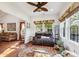Relaxing living room with large windows, comfortable seating, and decorative accents at 5115 Baltustrol Dr, Avon, IN 46123