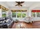 Bright living room with ample windows, comfortable seating, and stylish décor at 5115 Baltustrol Dr, Avon, IN 46123