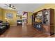 Spacious living area featuring a fireplace, an entertainment center, and seamlessly connected to the kitchen at 5115 Baltustrol Dr, Avon, IN 46123