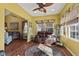 Relaxing living area with sofa, natural light, and wood flooring at 5115 Baltustrol Dr, Avon, IN 46123