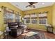 Bright sunroom featuring a cozy seating area, wood floors, and plenty of natural light at 5115 Baltustrol Dr, Avon, IN 46123