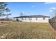 A fenced backyard featuring a covered patio, and an outdoor dining set, perfect for enjoying meals outdoors at 5195 N Frontage Rd, Fairland, IN 46126