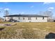 Spacious backyard with a fire pit and patio area, ideal for outdoor entertaining and relaxation at 5195 N Frontage Rd, Fairland, IN 46126