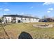 Expansive backyard featuring a fire pit, patio seating, and ample space for outdoor enjoyment at 5195 N Frontage Rd, Fairland, IN 46126