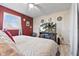 Inviting bedroom featuring a ceiling fan, natural light, and media console with TV at 5195 N Frontage Rd, Fairland, IN 46126