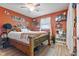 Unique bedroom with Harley Davidson themed decor, wood-look flooring, and a ceiling fan at 5195 N Frontage Rd, Fairland, IN 46126