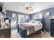 Cozy bedroom with neutral carpet, natural light, and black wood bed frame at 5195 N Frontage Rd, Fairland, IN 46126