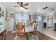 Open floor plan with view of dining area and kitchen with gray cabinetry and modern appliances at 5195 N Frontage Rd, Fairland, IN 46126