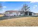 Beautiful white ranch style home with neat landscaping and a spacious front lawn at 5195 N Frontage Rd, Fairland, IN 46126