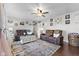 Cozy living room featuring two comfortable reclining sofas, a ceiling fan, and decor at 5195 N Frontage Rd, Fairland, IN 46126