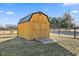 Exterior view of a wooden shed, offering ample storage space in a fenced backyard at 5195 N Frontage Rd, Fairland, IN 46126